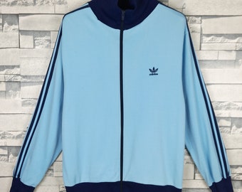 light blue adidas track top