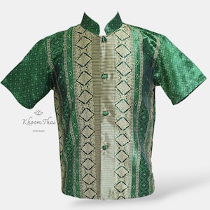 May include: A green and gold patterned short-sleeved shirt with a mandarin collar and button closure. The shirt features a traditional Thai design.