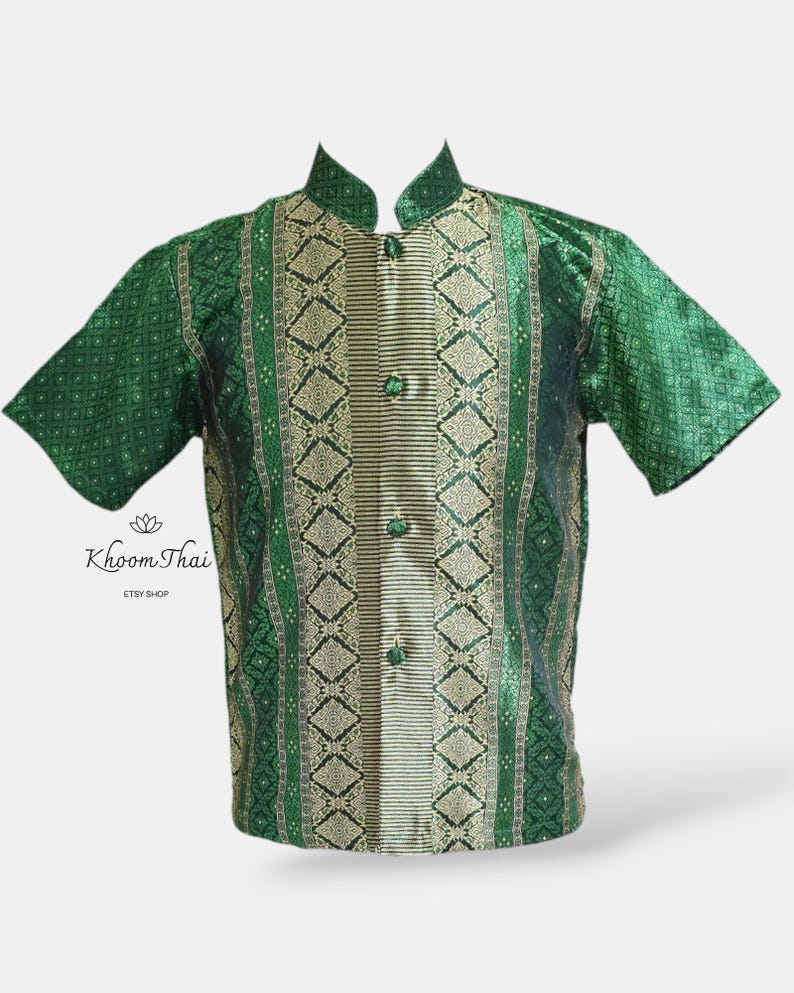 May include: A green and gold patterned short-sleeved shirt with a mandarin collar and button closure. The shirt features a traditional Thai design.