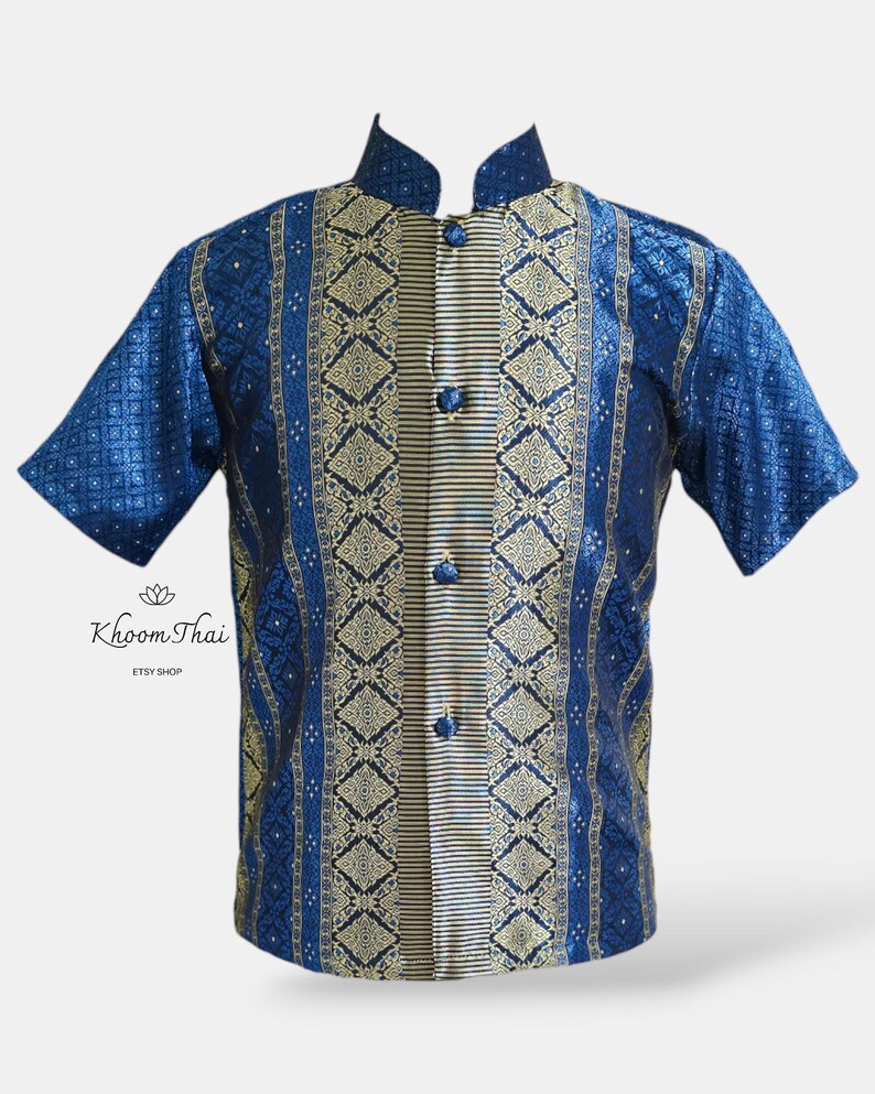 May include: A blue and gold short-sleeved shirt with a mandarin collar and a button-up front. The shirt features a traditional Thai pattern.