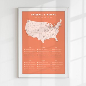 May include: A map of the United States with baseball stadiums marked with pins. The map is on a peach background with a white frame. The text "BASEBALL STADIUMS OF THE UNITED STATES" is at the top of the map.