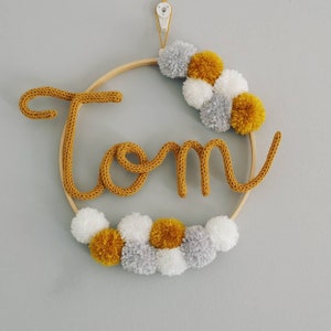 Personalized pompom crowns Tom