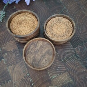 Monkey Pod Wooden Coasters (Set of 7) with raffia base in 6