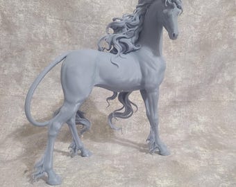 May include: A detailed, gray unicorn sculpture with flowing mane and tail. The mythical creature stands gracefully, showcasing intricate details of its form, including a spiraled horn and delicate hooves. The sculpture is set against a textured, neutral background.