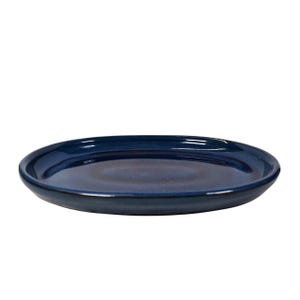 May include: A round, navy blue ceramic plate with a glossy finish. The plate has a slightly raised edge and a smooth, flat surface. The plate is suitable for serving food.