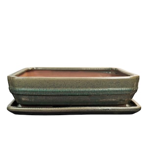 May include: A rectangular green glazed ceramic bonsai pot with a matching saucer. The pot has a textured surface and a raised rim.
