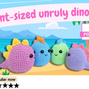 May include: Four crocheted dinosaur plushies in different colors: purple, blue, green, and light purple. The plushies have cute faces with black eyes and pink cheeks. The plushies are arranged on a beach scene background. The text "pint-sized unruly dinos!" is at the top of the image. The text "PDF" is in a white box with a pink border. The text "Popular now" is at the bottom of the image with five stars.