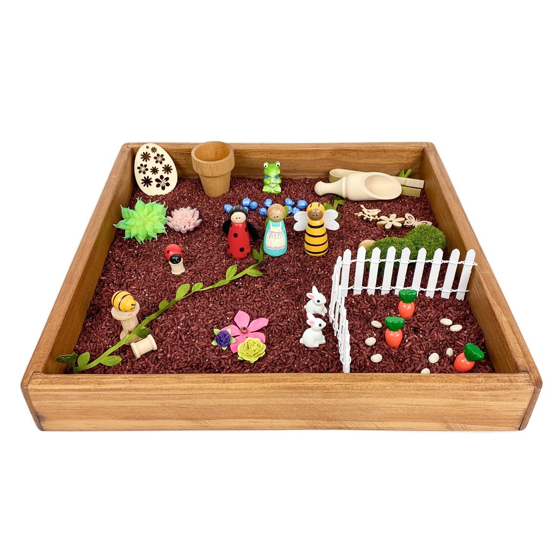 wooden sensory bin with gardening theme