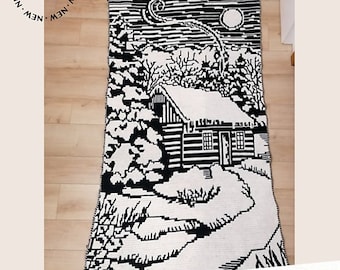 May include: Black and white crochet pattern for a winter scene with a cabin, trees, and a moon. The pattern is titled "Winter Night" and is a mosaic crochet pattern.
