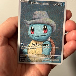 May include: A trading card featuring a blue Squirtle wearing a grey felt hat. The card has the text "Squirtle with Grey Felt Hat" and "Squirtle-Portrait". The card also has the text "HP 60".