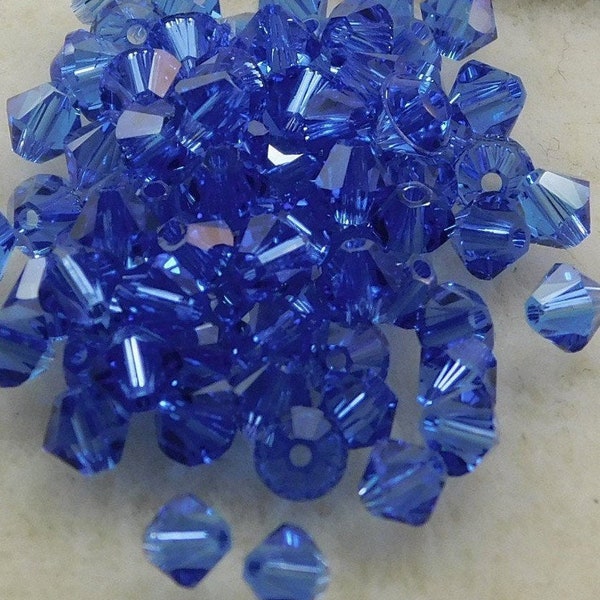 Sapphire Swarovski  4 mm Bicone (24 beads)