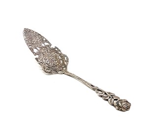 Heavy silverplate pie server with scroll work engraved lift. Vintage silver pie server with engraving
