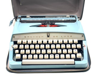 Mid-century Light Blue Brother Deluxe Manual Working Portable Typewriter with Warranty Certificate, 60s