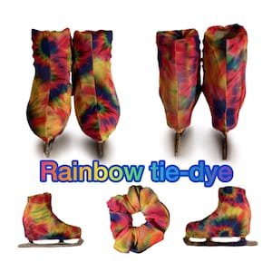 May include: Rainbow tie-dye ice skate covers and a hair scrunchie. The covers are made of a stretchy fabric and have a colorful tie-dye pattern. The scrunchie is also made of a stretchy fabric and has a colorful tie-dye pattern.