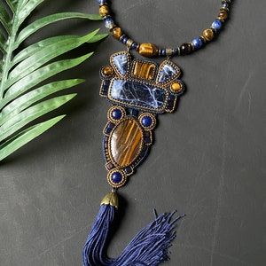 Bead embroidery necklace with stones. Necklace embroidered with beads with tiger's eye and sodalite stones, sautoir with pendant and tassel