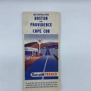 May include: Vintage travel map for Metropolitan Boston, Providence, and Cape Cod. The map features a Texaco gas station illustration with the text "Tour with TEXACO." The map is a promotional item from Texaco Touring Service.