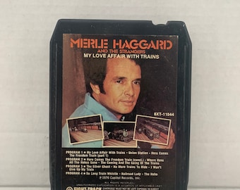 Può includere: Una cassetta a otto piste con Merle Haggard e The Strangers. La copertina dell'album è un primo piano di Merle Haggard, con uno sfondo nero e il titolo dell'album "My Love Affair With Trains". La cassetta è etichettata "8-Track Cartridge 33 1/3 IPS".