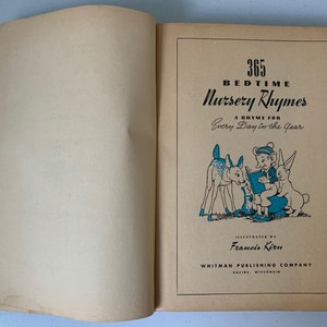 Puede incluir: Un libro vintage titulado "365 Canciones de cuna para dormir" con una rima para cada d&iacute;a del a&ntilde;o. La portada presenta una ilustraci&oacute;n de un ni&ntilde;o leyendo a un ciervo y un conejo.
