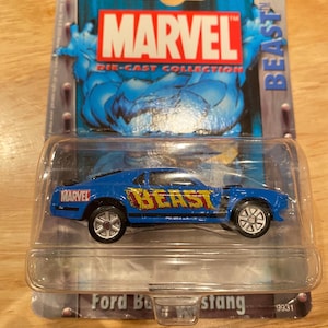 May include: A blue die-cast Ford Mustang car with "BEAST" and "MARVEL" logos on the side. The car is in a plastic package with a picture of the Marvel character Beast on the back.