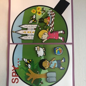 May include: A colourful I Spy game with two circular images. The top image shows a girl with blonde hair, a red dress, and a church in the background. The bottom image shows a boy with brown skin, a blue shirt, and a tree with a Bible underneath. Both images have bees, flowers, and other objects to find.