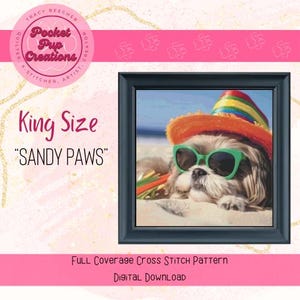 May include: King size cross stitch pattern of a Shih Tzu dog wearing sunglasses and a colorful beach hat, lying on a beach. The pattern is titled "Sandy Paws".