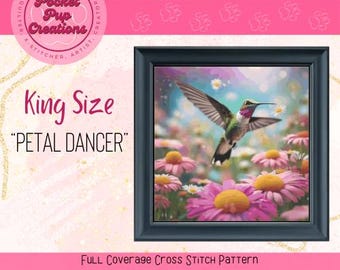 May include: King Size cross stitch pattern featuring a hummingbird in flight over a field of pink flowers. The pattern is titled "Petal Dancer".