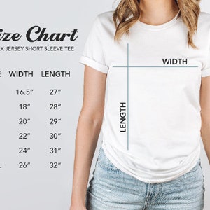 May include: Size chart for a unisex jersey short sleeve tee. The chart shows the width and length measurements in inches for sizes XS, S, M, L, XL, and 2XL.