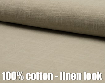 May include: Close-up of a beige fabric with a linen-like texture. The fabric is 100% cotton.