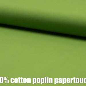 May include: A close-up of a smooth, green fabric. The fabric is 100% cotton poplin papertouch.