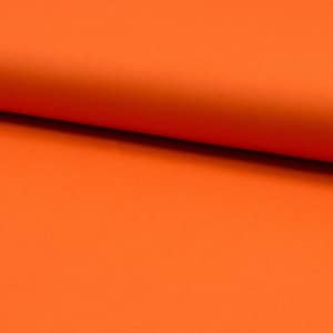 May include: A close-up of a bright orange fabric. The fabric is smooth and has a slight sheen.