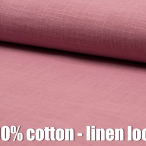 Op de afbeelding: Close-up van een zachte, roze stof met een linnen-achtige textuur. De stof is 100% katoen.