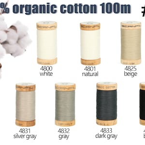 May include: Seven spools of Scanfil 100% organic cotton thread, each 100m long, labeled #6. Colors include white, natural, beige, silver gray, gray, dark gray, and black. Each wooden spool features the brand name and color code printed below.