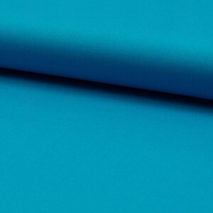 May include: A close-up of a bright turquoise fabric. The fabric is smooth and has a slight sheen.