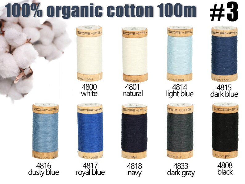 K&ouml;nnte beinhalten: Zehn Garnrollen aus 100% Bio-Baumwolle von Scanfil, jeweils 100m lang, beschriftet mit #3. Die Farben umfassen Wei&szlig;, Natur, Hellblau, Dunkelblau, Staubblau, K&ouml;nigsblau, Marine, Dunkelgrau und Schwarz, angeordnet in zwei Reihen.