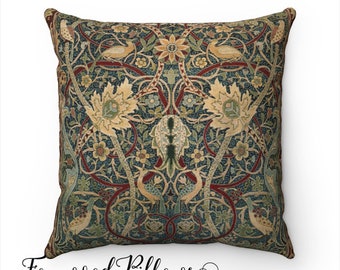 May include: Square cushion with a detailed floral and bird pattern in shades of teal, green, red, and gold. The cushion features a symmetrical design with stylized leaves and birds. The text "Foxwood Pillows" is at the bottom.