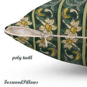 May include: A green and yellow floral cushion with a zipper closure. The cushion is made of poly twill fabric.