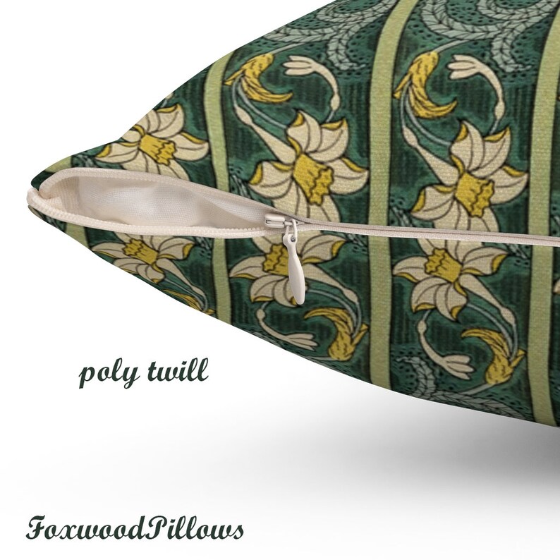 May include: A green and yellow floral cushion with a zipper closure. The cushion is made of poly twill fabric.