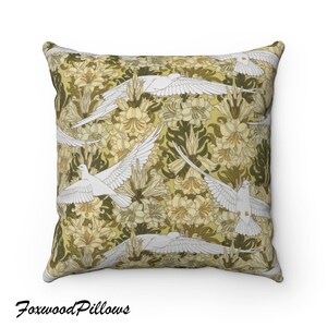 May include: A decorative throw pillow with a repeating pattern of white doves flying over stylized yellow flowers on a green background.