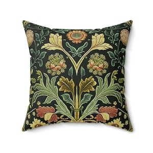 May include: Square cushion with a floral design in yellow, green, and red on a black backdrop. The pattern showcases stylized leaves and flowers, offering a vintage aesthetic.