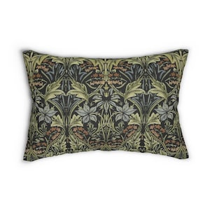 May include: A rectangular pillow with a dark green background and a repeating floral pattern in shades of green, blue, and brown.