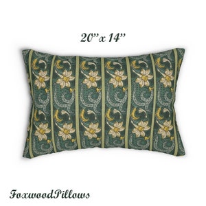 May include: A green and yellow floral patterned pillow measuring 20" x 14". The pillow features a repeating pattern of stylised flowers and leaves.