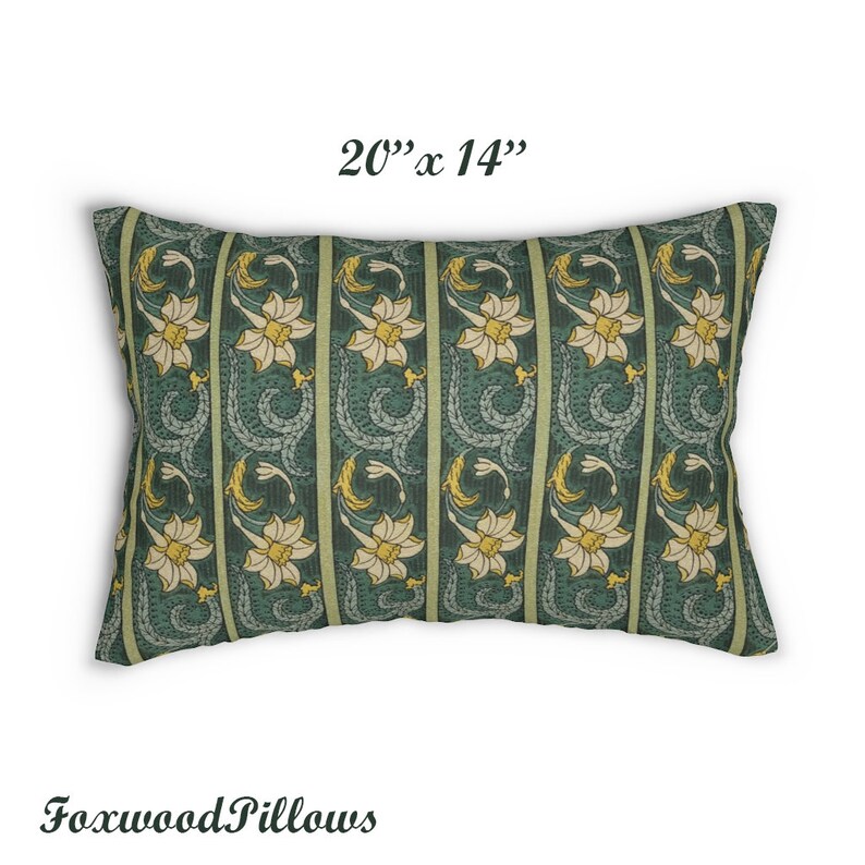 May include: A green and yellow floral patterned pillow measuring 20" x 14". The pillow features a repeating pattern of stylised flowers and leaves.