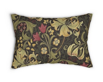 May include: A rectangular cushion with a dark green background and a floral pattern featuring yellow, red, and green lilies, leaves, and flowers.