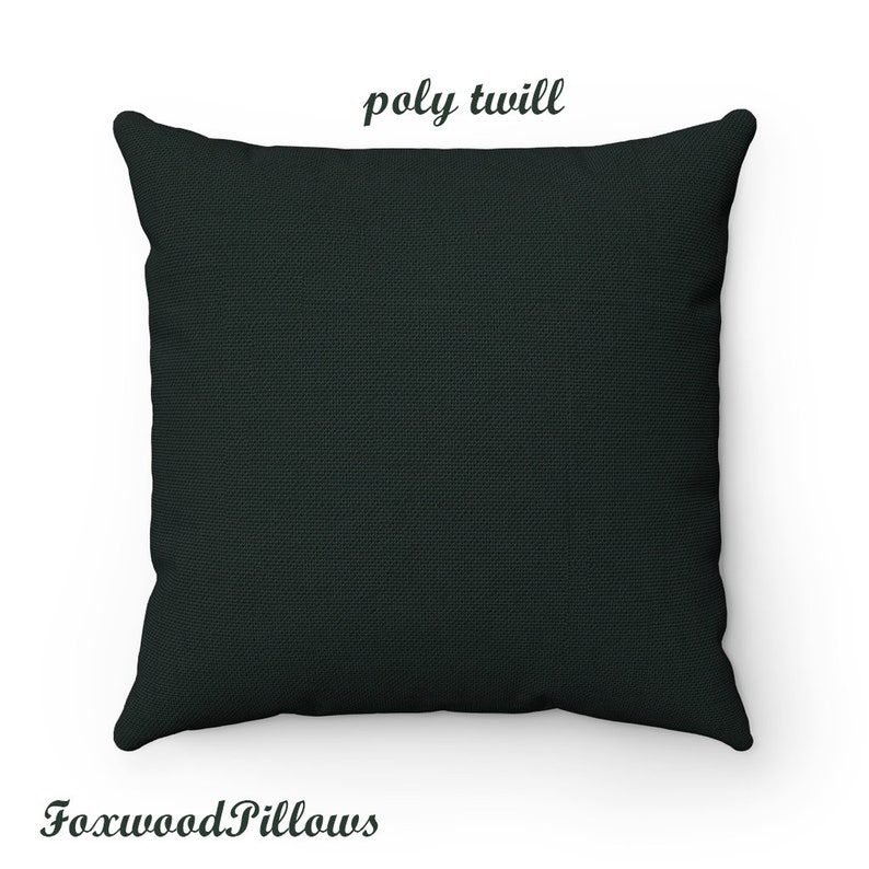May include: A dark green square pillow with the text "poly twill" printed in white on the top.