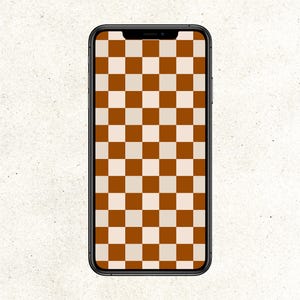 Puede incluir: Un teléfono inteligente negro con un patrón de cuadros marrones y blancos en la pantalla.