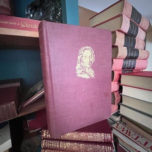 May include: A set of three ceramic mugs with a speckled, matte finish. The mugs are in shades of cream, light gray, and dark gray. Each mug has a simple, minimalist design and a rounded handle.