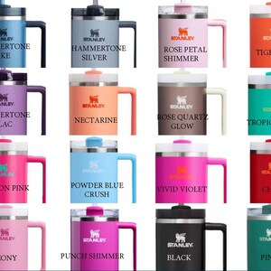 May include: A collection of 12 Stanley brand insulated mugs in a variety of colours and designs. The mugs have a handle and a lid with a straw.