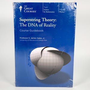 May include: A course guidebook titled "Superstring Theory: The DNA of Reality" by Professor S. James Gates, Jr. The cover is blue with white text and a graphic of a 3D geometric shape. The book is part of "The Great Courses" series.