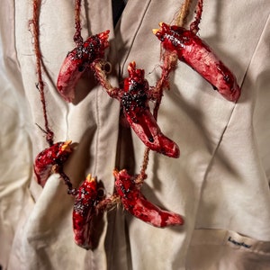 May include: A white ceramic mug with a black handle and the text "But First, Coffee" in a handwritten style. The mug is on a white surface. The mug is approximately 4 inches tall.