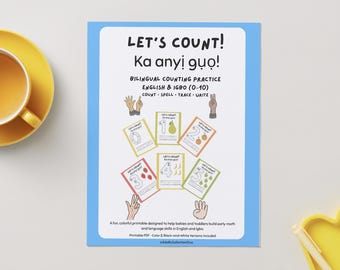 May include: A blue-bordered educational poster titled "LET'S COUNT!" with text in English and Igbo. It features colorful cards with numbers 0-5, fruits, and hand illustrations. A yellow cup and tray are visible.